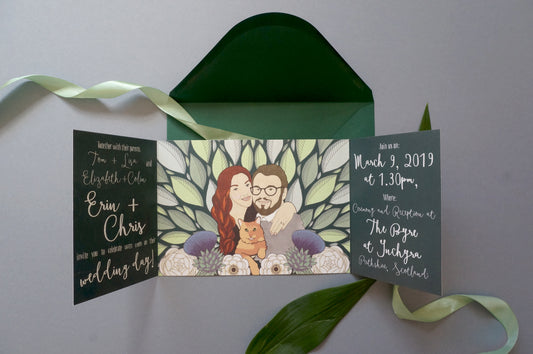 Couple portrait and pet portrait wedding invitation sitting on top of a green envelope with a green ribbon.